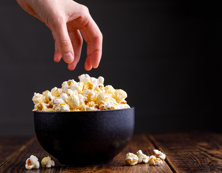Hand and popcorn