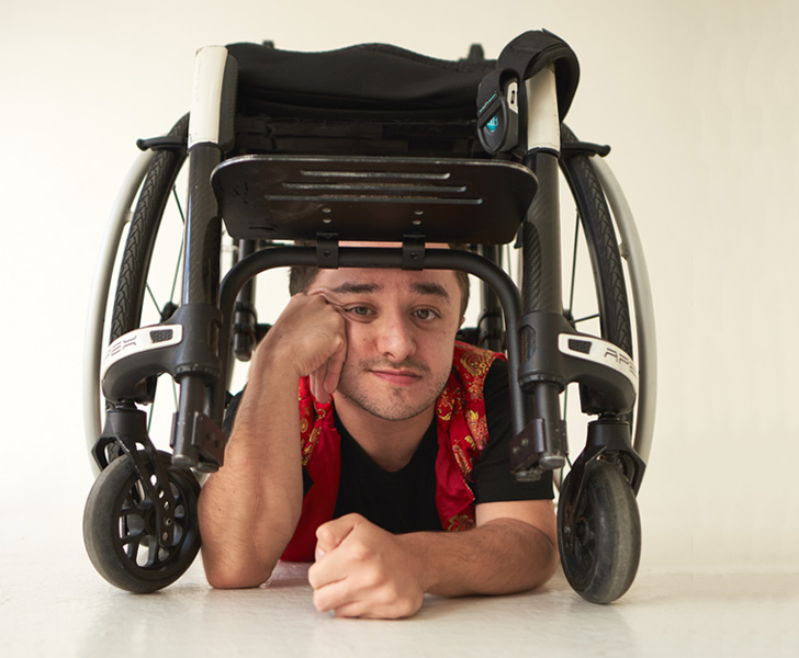 Paulo Silva, posing to the camera under his APEX C rigid manual wheelchair 